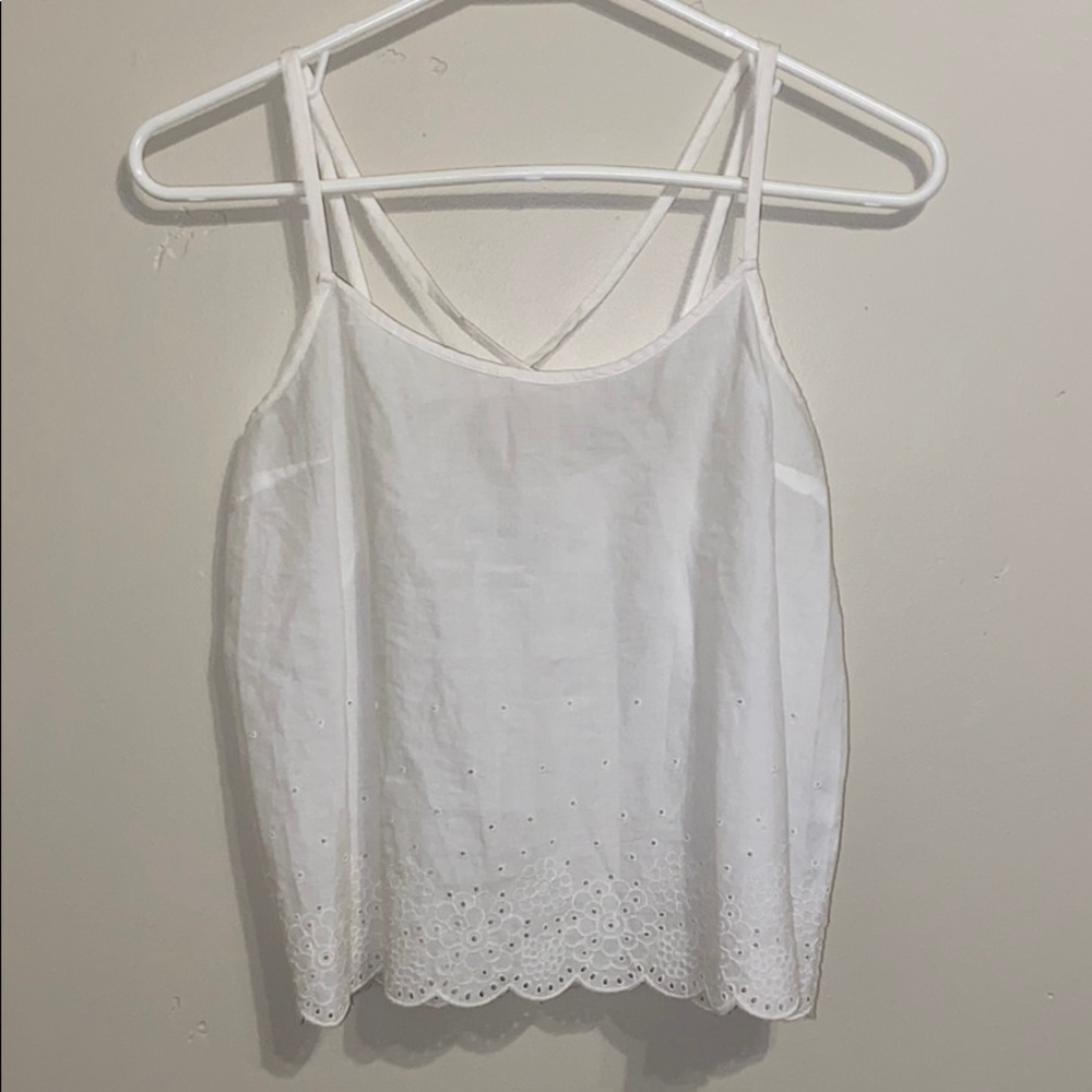 White Hollister tank top with designs.
